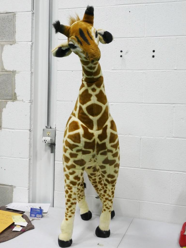 Large Plush Melissa and Doug Giraffe: Large Plush Melissa and Doug Giraffe - roughly 4 feet tall. This mythical creature is like a horse with a long neck and spots!