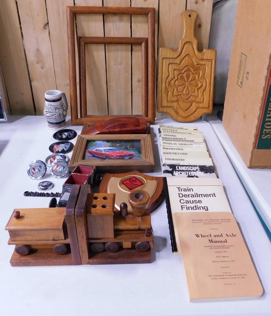 Collectibles incl Car Emblems, an Automotive News Wood Pen in a Wood Car Shaped Box,: Collectibles incl Car Emblems, an Automotive News Wood Pen in a Wood Car Shaped Box, Carved Wood Train Shaped Bookends, Carved Wood Decorative Cutting Board, How To Manuals including citizenship in th