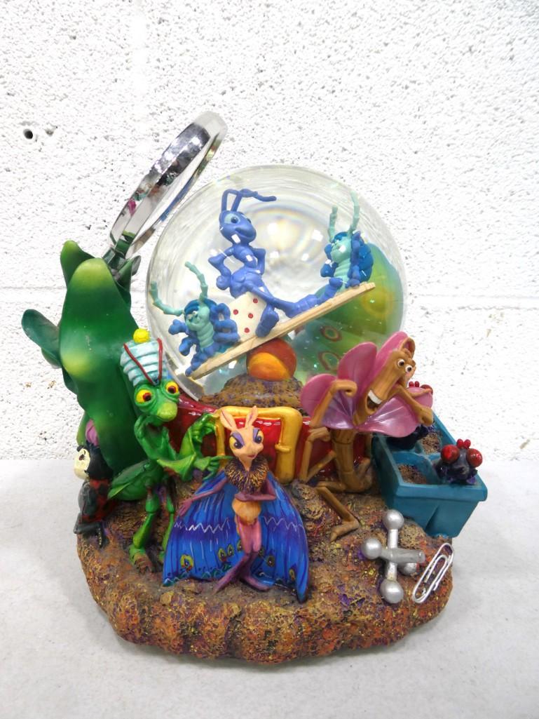 Disney A Bug's Life Musical Snow Globe: Disney A Bug's Life Musical Snow Globe . Condition: Magnifier is broken off and needs to be reglued.