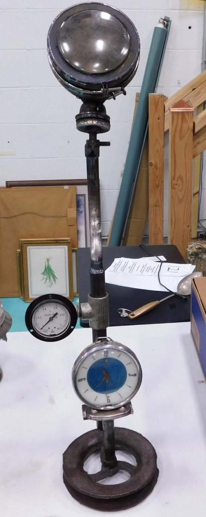 Steampunk Clock with pressure gauge that does nothing: Steampunk Clock with pressure gauge that does nothing - the clock is just an old wind up clock attached to some pipes with a pressure gauge and some sort of light that does nothing either. Pretty craz