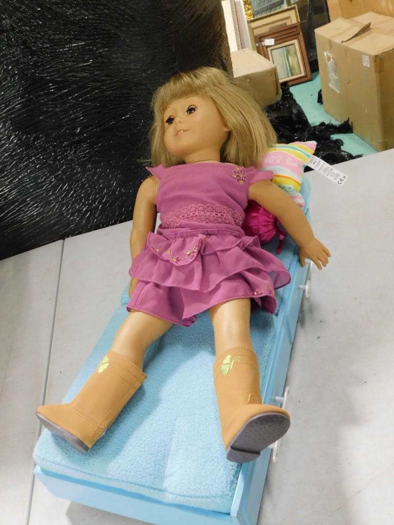 American Girl Doll 18" with Blue American Girl Bed: American Girl Doll 18" with Blue American Girl Bed . She is stamped "Pleasant Company" on the back of her neck. Condition: very loose joints, Needs to be restrung. Her hair has been cut