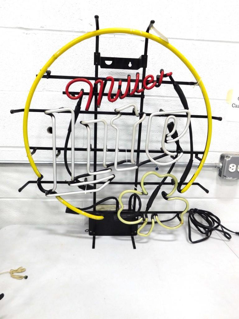 Miller Lite Neon Beer Sign with Shamrock: Miller Lite Neon Beer Sign with Shamrock Condition: this does not work. We think it needs a new plug because when we first plugged it in it came on for a second or so and then turned off. After that i