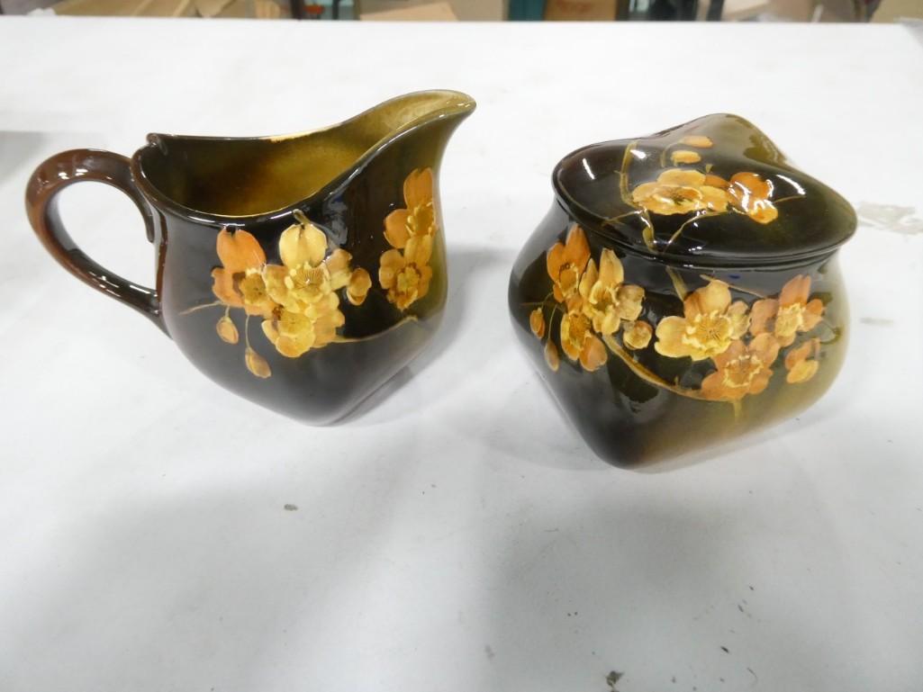 Antique Rookwood Pottery 692-WWS Creamer and Sugar Bowl: Antique Rookwood Pottery Creamer and Sugar Bowl 692-WWS Condition: 2 hairlines to the sugar bowl, crazing (crackling to the glaze) throughout consistent with age. Condition; The absence of a conditi