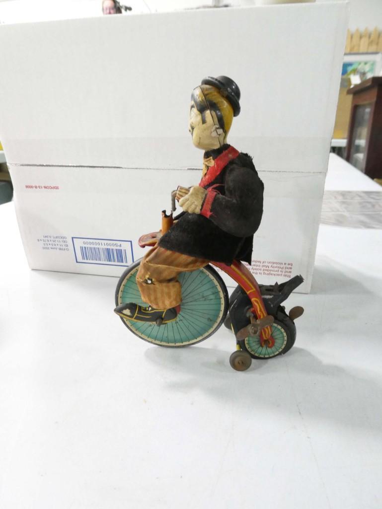 Vintage Tin Toy Penny Farthing Wind Up Toy: Vintage Tin Toy Penny Farthing Wind Up Toy with Asian Caricature Rider Condition: mechanism works, but it doesn't have enough friction on the wheels to propel it forward