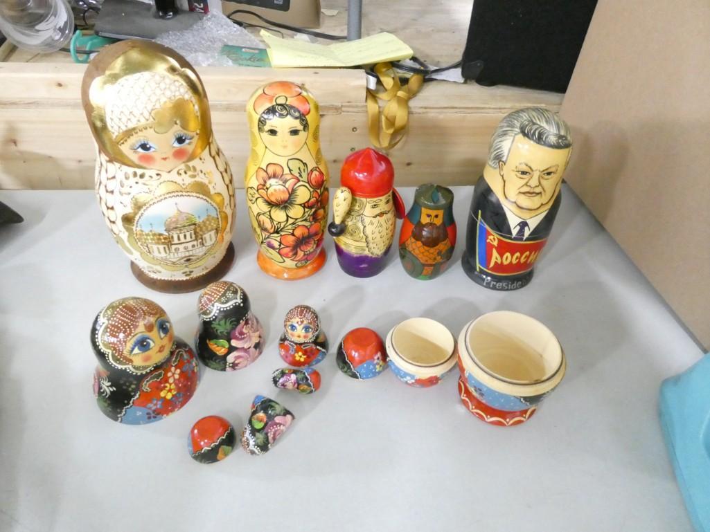 6 Sets of Russian Nesting Dolls Tallest is about 10" Tall: 6 Sets of Hand Painted Russian Nesting Dolls . Tallest is about 10" tall. Note: it is humid here right now and we cannot get these open, so we do not know how many are inside. If you live in a dry