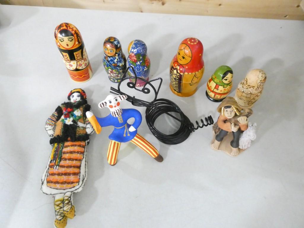 6 Sets of Nesting Dolls Plus Handmaid Doll, Figurines, Wire Cat Mail Sorter: 6 Sets of Hand Painted Nesting Dolls Plus Handmaid Doll, Figurines, Vintage Mid Century Wire Cat Mail Sorter Note: it is humid here right now and we cannot get these nesting dolls open, so we do not k