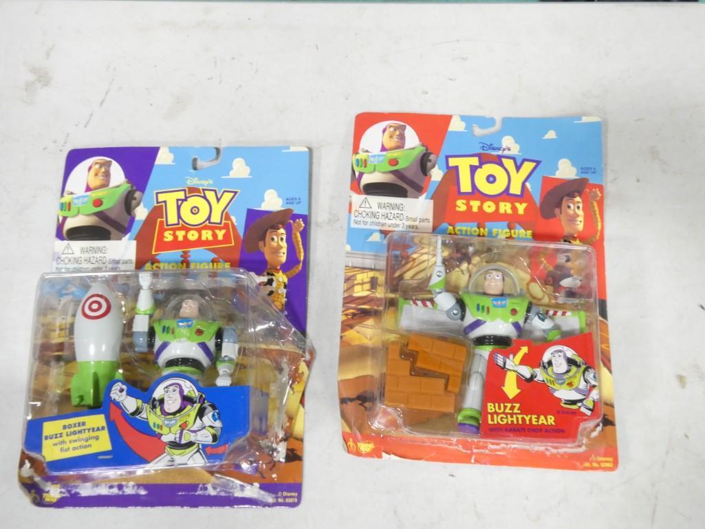 2 Buzz Lightyear Toy Story Toys incl Karate Chop Action and Swinging Fists: 2 Buzz Lightyear Toy Story Toys incl Karate Chop Action and Swinging Fists Condition: both are new in package, but 1 has the package bubble detached.