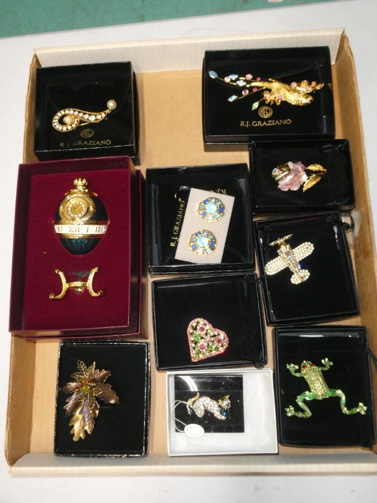 Lot of Costume Jewelry incl Rhinestone . Includes RJ Graziano Brooches: Lot of Costume Jewelry incl Rhinestone . Includes RJ Graziano Brooches . Also includes a Joan Rivers Egg Clock