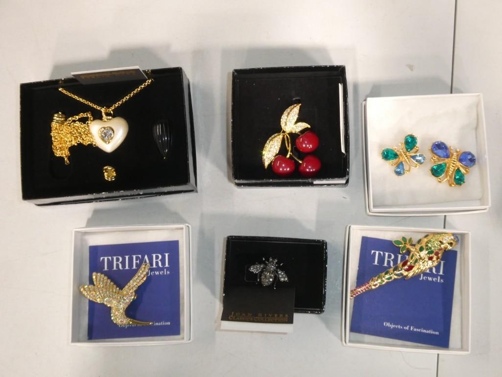 Costume jewelry incl Trifari and Joan Rivers: Costume jewelry incl Trifari and Joan Rivers . Includes brooches, necklace, earrings