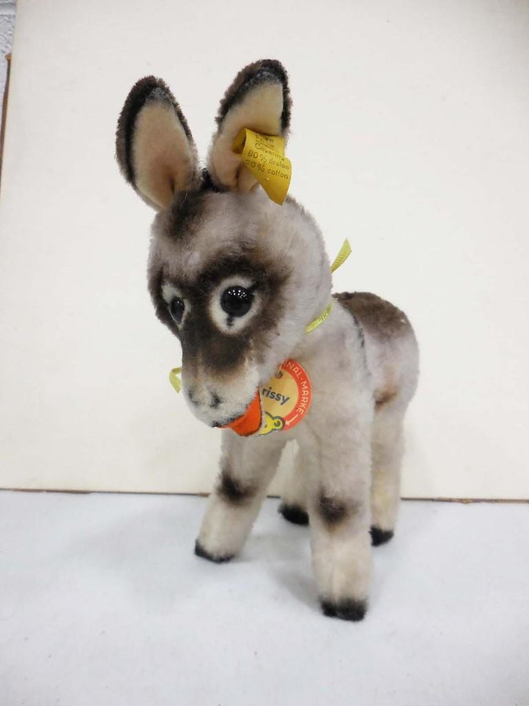 Steiff Donkey Grissy with Original Tags and Ear Button Plush Animal: Steiff Grissy Donkey with Original Tags and Ear Button Plush Animal. Measures about 9 1/4" tall to the tip of the ear.