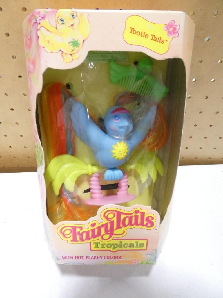 Vtg 1987 Hasbro Fairy Tails Tropicals Hootie Tails Bird NIB: Vintage 1987 Hasbro Fairy Tails Tropicals Hootie Tails Bird NIB. Hootie blue bird is new in sealed box with accessories. Box has age wear, damage, and clear cello has separated from box. Items inside 