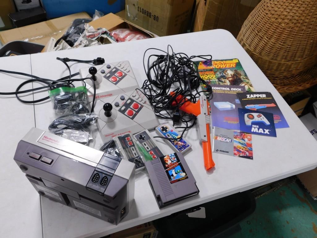 NES Nintendo Lot including system, Controllers 2 NES Advantage Joysticks, Light Gun,: NES Nintendo Lot including system, Controllers 2 NES Advantage Joysticks, Light Gun, some cords and manuals, etc. Mike Tyson's Punchout! is in the system, but not shown in the picture.
