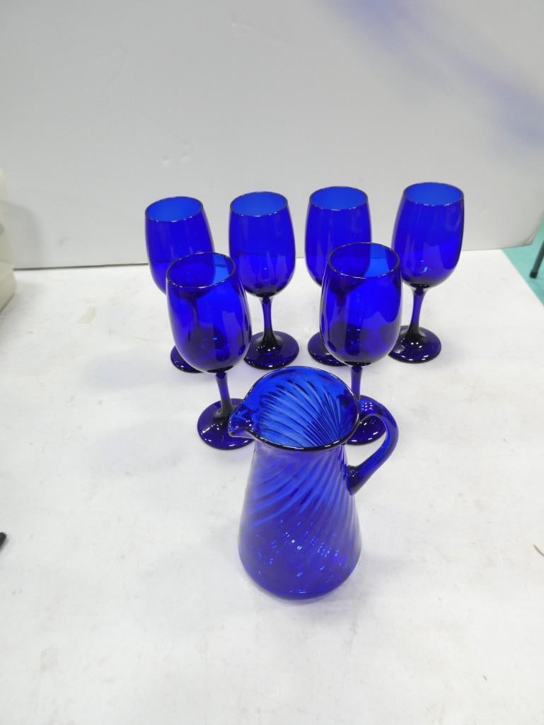 Lot of 6 Blue Glass Wine Glasses and a small pitcher: Lot of 6 Blue Glass Wine Glasses and a small pitcher