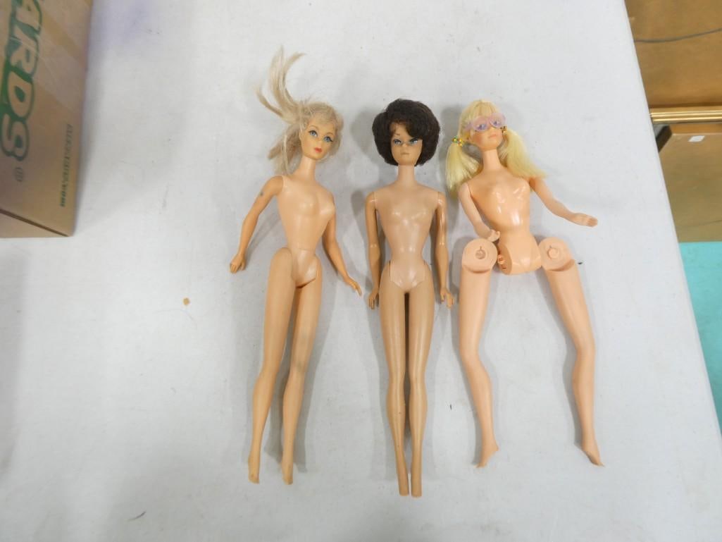 1960s Brunette Bubblecut Barbie, 1960s Twist N Turn TNT Barbie, and 1969 Talking PJ: 1960s Brunette Bubblecut Barbie (has nose nip), 1960s Twist N Turn TNT Barbie, and 1969 Talking PJ (doesn't talk). Legs are broken off, but this is a common defect.