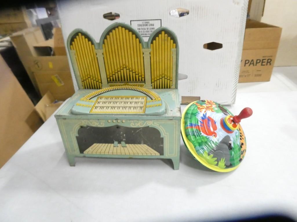Vintage Metal Top and Piano Toy: Vintage Metal Top and Piano Toy. The piano is wind up and stuff turns, but it wasn't making any piano type noises.