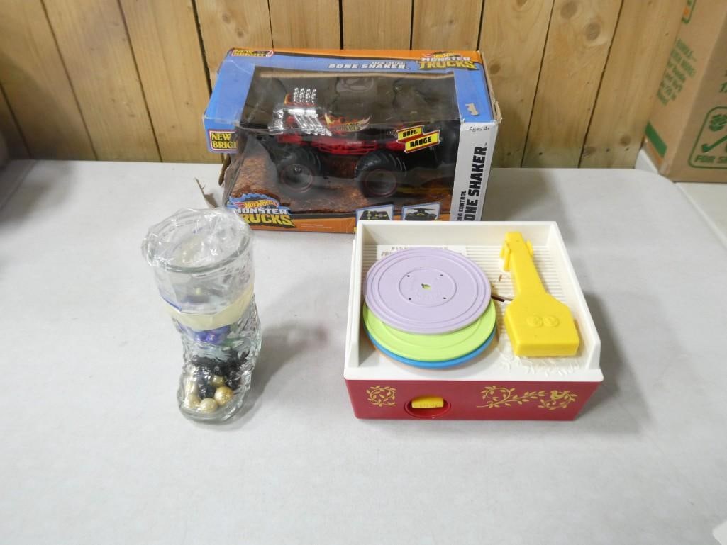 Jar of Marbles, Fisher Price Record Player Toy, and a Toy Monster Truck New in Box (1 of 4)