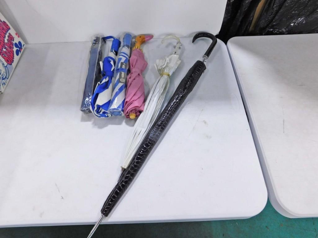 Lot of 6 Umbrellas: Lot of 6 Umbrellas Condition: mostly unchecked but white/clear one has a small tear