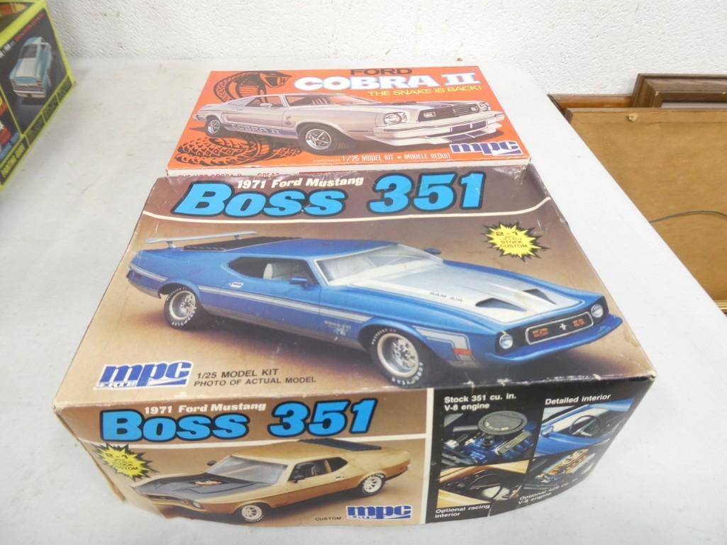 2 MPC Model Car Kits incl Ford Cobra II and 1971 Ford Mustang Boss 351 Both 1/25 Scale: 2 MPC Model Car Kits incl Ford Cobra II and 1971 Ford Mustang Boss 351. Both 1/25 Scale. Both in original boxes. Includes everything that you see in the pictures. If you have questions, please ask pri