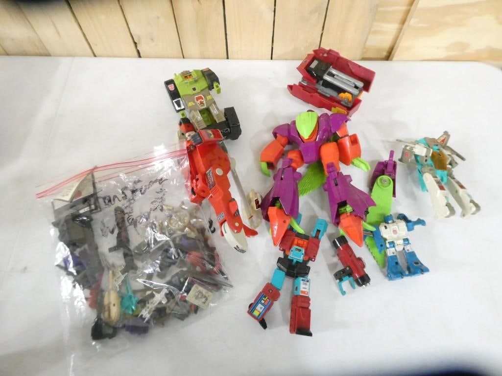 Lot of 1980's Transformer Toys with parts and weapons accessories, etc. (1 of 7)
