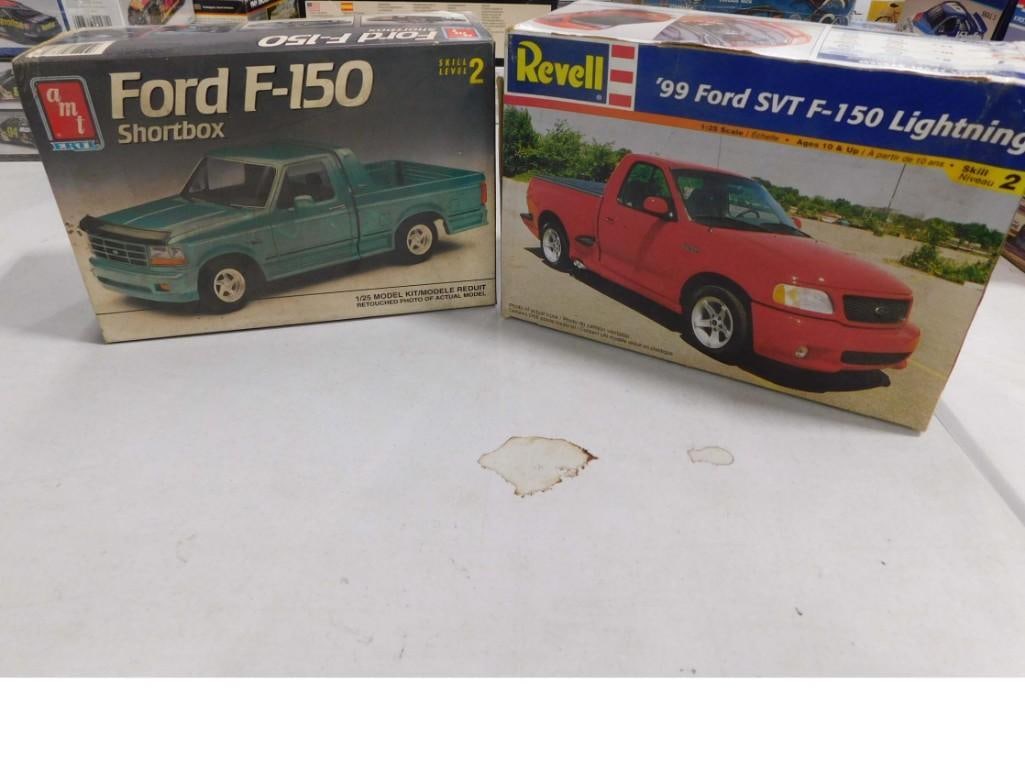 2 Model Truck Kits incl AMT Ertl Ford F-150 Shortbox and Revell '99 SVT F-150 Lightning: 2 Model Truck Kits incl AMT Ertl Ford F-150 Shortbox and Revell '99 SVT F-150 Lightning . Both are 1:25 scale and in open boxes. Includes everything that you see in the pictures