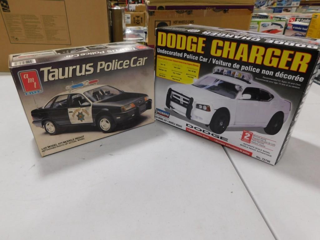 2 Model Police Car Kits incl Lindberg Dodge Charger and AMT Taurus Police Car: 2 Model Police Car Kits incl Lindberg Dodge Charger and AMT Taurus Police Car . Both are in open boxes and include everything that you see in the pictures