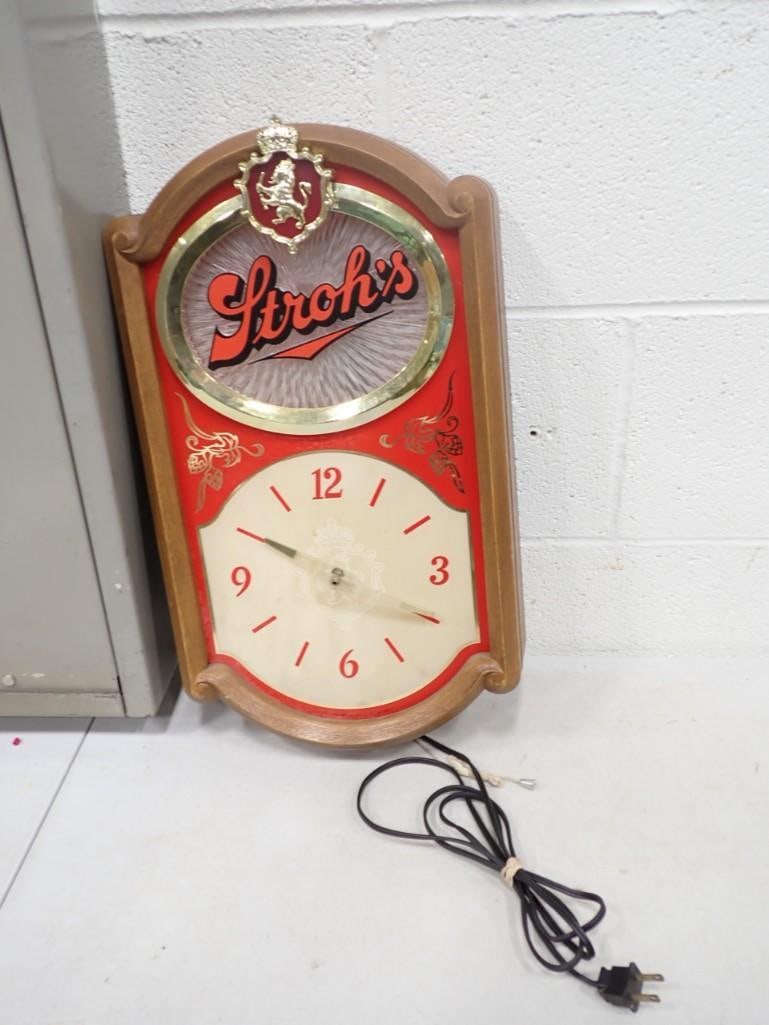 Stroh's Beer / Bar light up Wall Clock: Stroh's Beer / Bar light up Wall Clock - it works, but one of the clock hands has a crack. When the light is on, the clear behind where it says "Stroh's" moves.