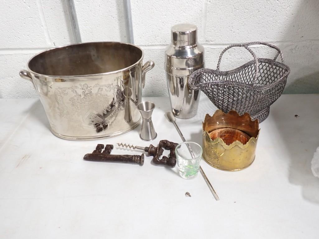 Lot of Bar Accessories incl Skeleton Key Form Metal Corkscrew, Oval Handled Metal Wine Cooler: Group of Bar Accessories including a skeleton key form metal corkscrew, an oval handled metal wine cooler with crest, a brass wine coaster with crest, a Pottery Barn cocktail shaker, a stainless steel