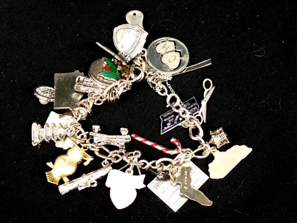 Sterling Silver Chain Marked .925 with Charms incl Some Silver Charms: Sterling Silver Chain Marked .925 with Charms incl Some Silver Charms . Chain has a safety clasp