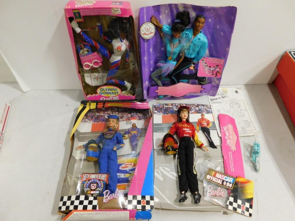 4 Barbies incl Olympic Skater Barbie & Ken, Olympic Gymnast, Nascar Barbie Dolls Lot: 4 Barbies incl Olympic Skater Barbie & Ken, Olympic Gymnast, Nascar Barbie Dolls Lot. Dolls are new in damaged boxes. Nascar and Olympic Skater Barbie and Ken are attached to cardboard backing onl