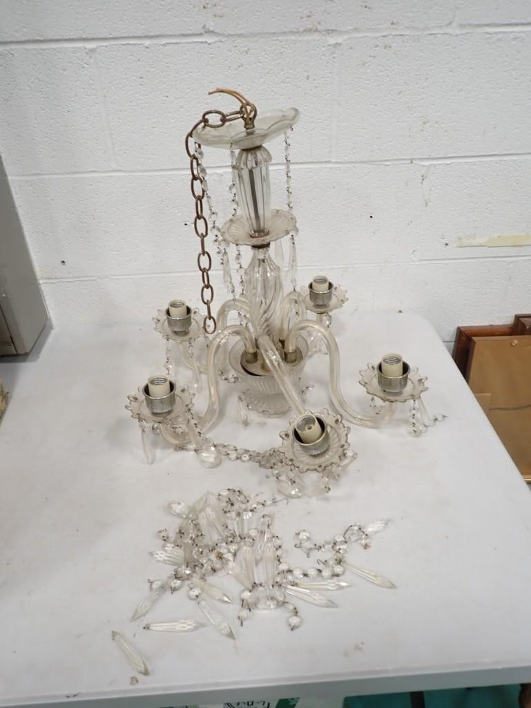 Clear Glass and Plastic Chandelier: Clear Glass and Plastic Chandelier - many of the crystals are disconnected. They may not all be there, see all pictures for what all is included.