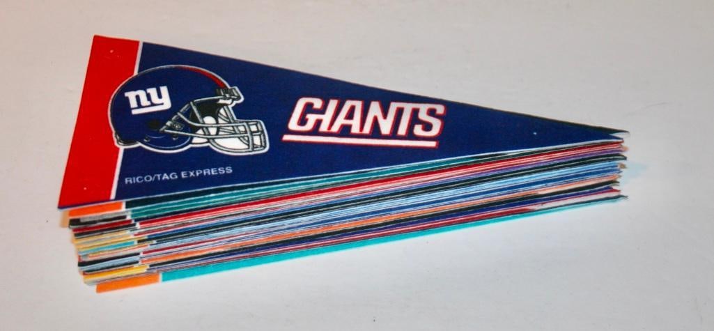 31 NFL Mini Pennants: 31 NFL Mini Pennants Measure approximately 9 inches by 4 inches. Created by RICO / Tag Express.