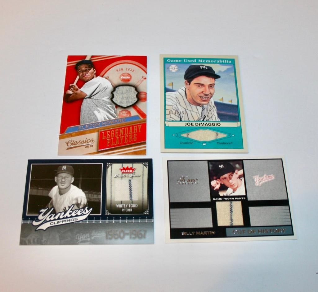 4 New York Yankees Relic Cards - DiMaggio, Ford, Martin, Howard: 4 New York Yankees Relic Cards - DiMaggio, Ford, Martin, Howard Each card contains a swatch of material from a game used uniform. Players included are Joe DiMaggio, Whitey Ford, Billy Martin, and Els