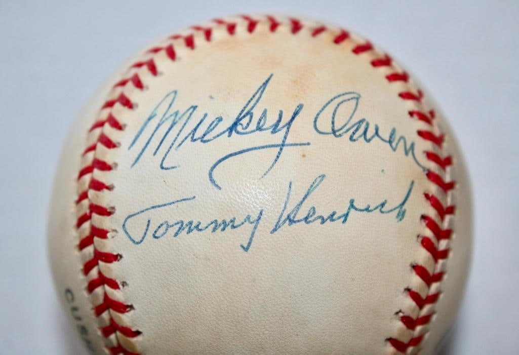 Mickey Owen / Tommy Henrich Dual Signed Baseball: Mickey Owen / Tommy Henrich Dual Signed Baseball Two primary players in the most infamous drop third strikes in baseball. No COA.