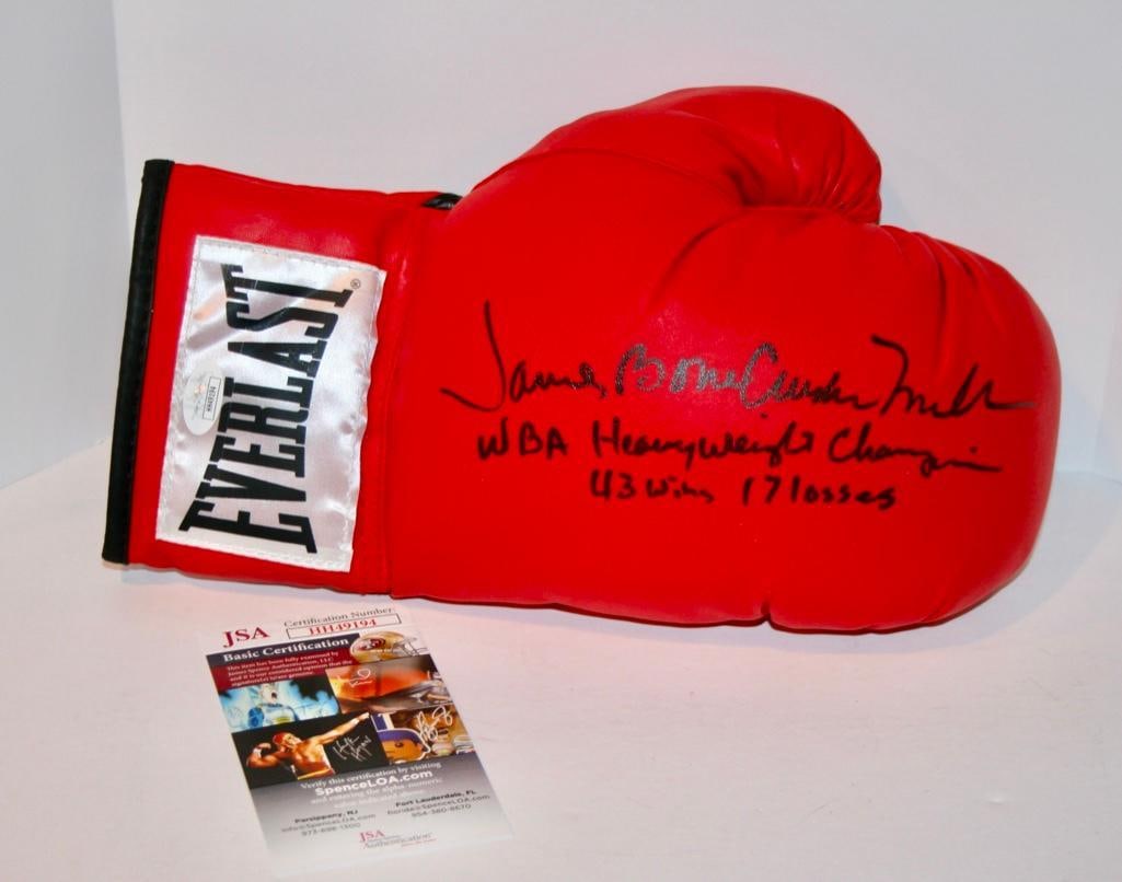 James "Bone Crusher" Smith Signed Boxing Glove With JSA COA: James "Bone Crusher" Smith Signed Boxing Glove With JSA COA The Bone Crusher added the inscription "WBA Heavyweight Champion 43 Wins 17 Losses".