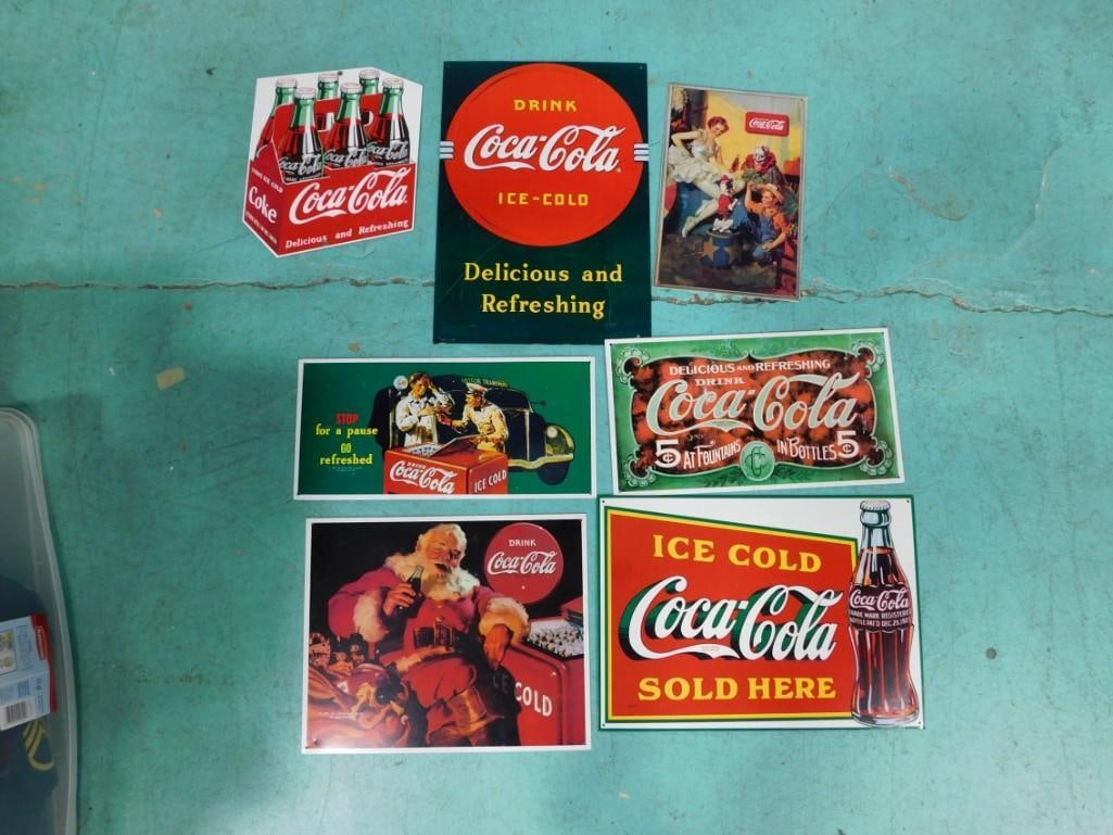 Collection of 7 Coca Cola Signs: 1 Ande Rooney Porcelain Enameled Six Pack Bottle Sign and 6 Printed: Collection of 7 Coca Cola Signs: 1 Ande Rooney Porcelain Enameled Six Pack Bottle Sign and 6 Printed Aluminum Advertising Signs. Porcelain sign measures approximately 12" x 10"