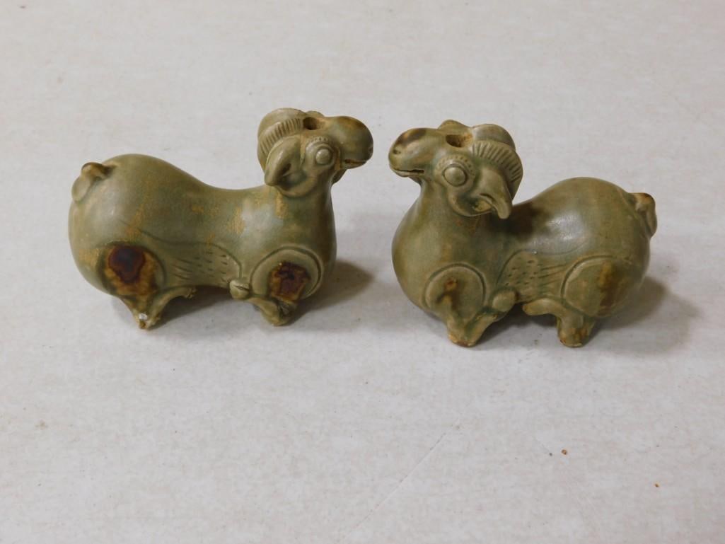 A Pair of Chinese Yue Ware Celedon Glazed Stoneware Kneeling Ram Form Vessels: A Pair of Chinese Yue Ware Celedon Glazed Stoneware Kneeling Ram Form Vessels