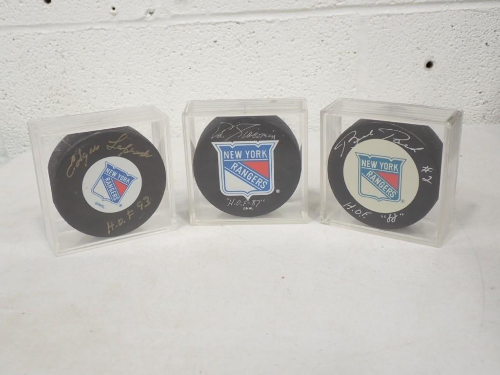 3 Signed NHL Hockey Pucks including Edgar Laprade HOF 1993, Ed Giacomin HOF 1987, Brad Park HOF 1988 (1 of 6)