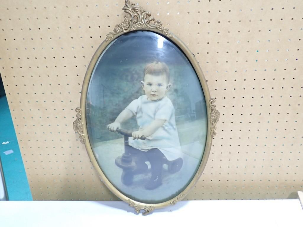 Antique Oval Framed Photo of kid on tricycle (1 of 5)