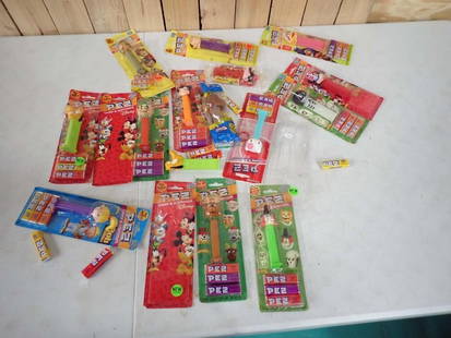 Lot of Pez Dispensers Most New in Package incl Pluto, Hello Kitty, Etc: Lot of Pez Dispensers Most New in Package incl Pluto, Hello Kitty, Etc. Some are out of the package and a couple of packs are empty