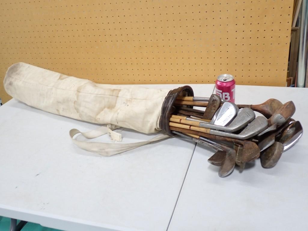 Golf Clubs Many Vintage with Wood Shafts: Large Lot of Golf Clubs Many Vintage with Wood Shafts . Includes a golf bag. Golf bag has water stains