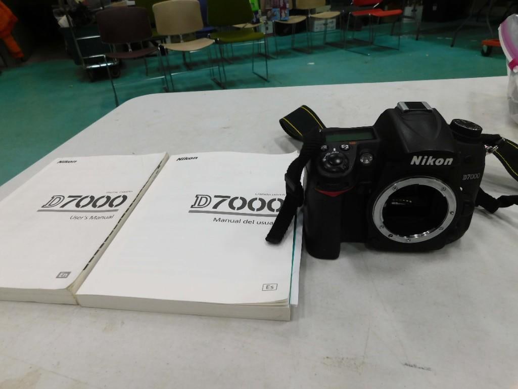 Nikon D7000 Camera Body with Paperwork: Nikon D7000 Camera Body with Paperwork. Appears to be in nice shape. Untested