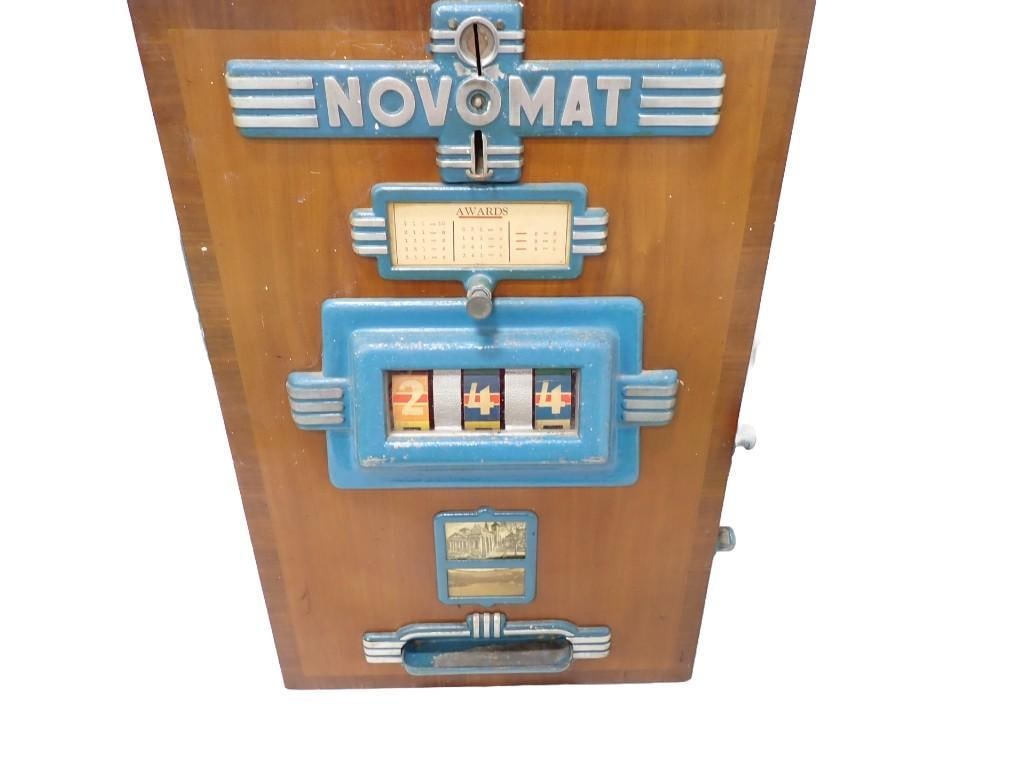 1953 Novomat Slot Machine Made in Germany: Vintage 1953 Novomat Slot Machine Made in Germany . Wooden case. Lever works, reels spin freely. Missing keys, but can be accessed by removing screws from the back