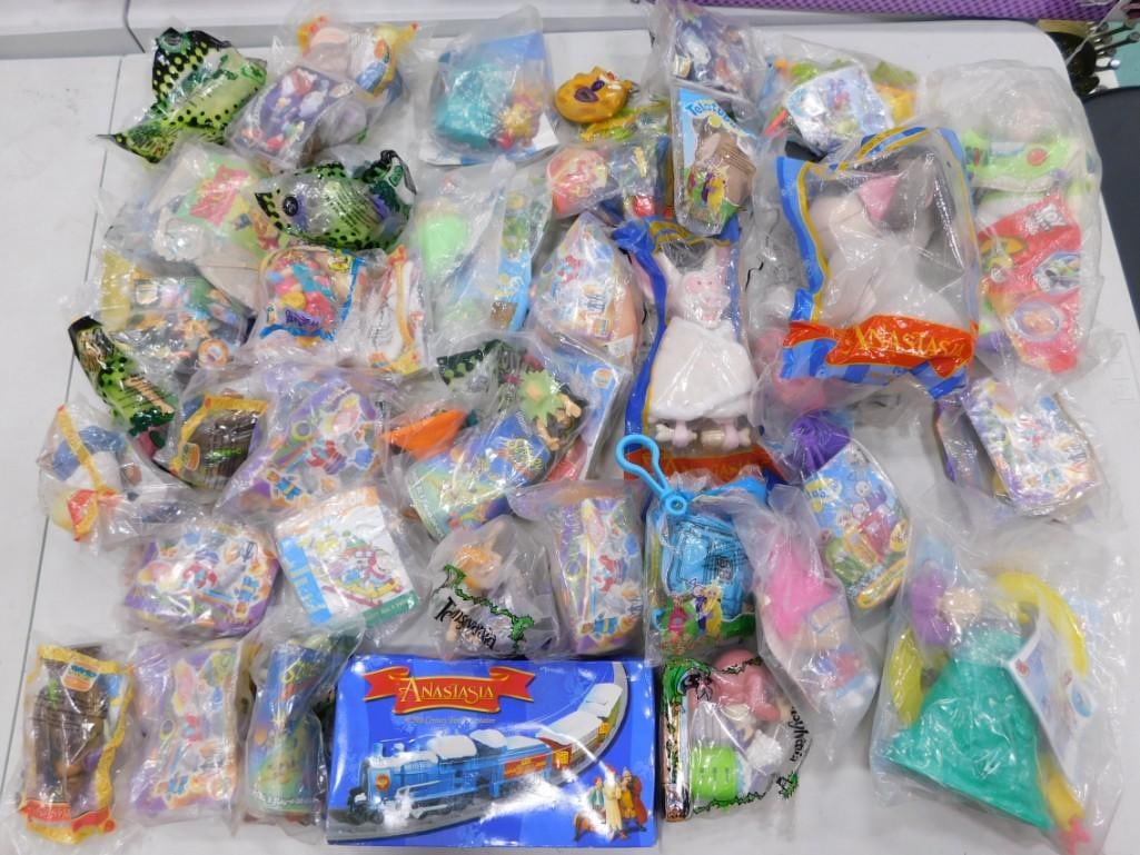 42 McDonalds & Burger King Happy Meal Anastasia, Rugrats, Trolls, Etc NIP Lot: Approximately 42 McDonalds and Burger King Happy Meal Toys including Anastasia, Toy Story, Nickelodon, Teletubbies, Rugrats, Scooby Doo, plush, etc lot. Most new and sealed