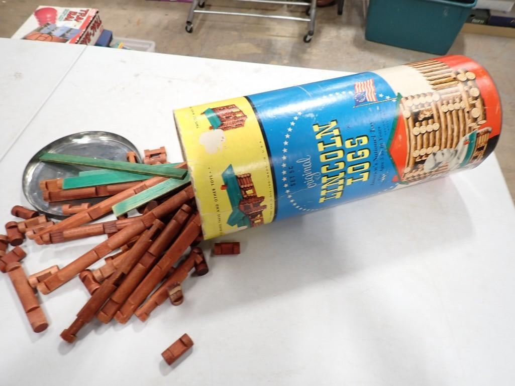 Vintage Container of Lincoln Logs: Vintage Container of Lincoln Logs Condition: unchecked for completeness. Includes everything that you see in the pictures