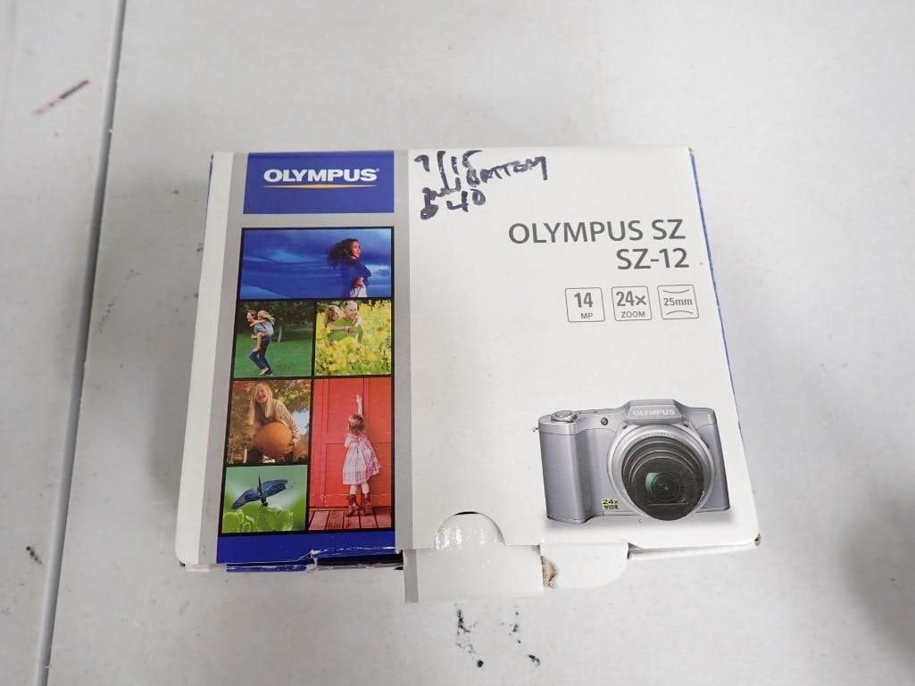 Olympus SZ-12 Camera: Olympus SZ-12 Camera Condition - the cord with it is the wrong cord, so you will need a new cord to use it or will have to pull out the memory card. There's three batteries that need charging and ther