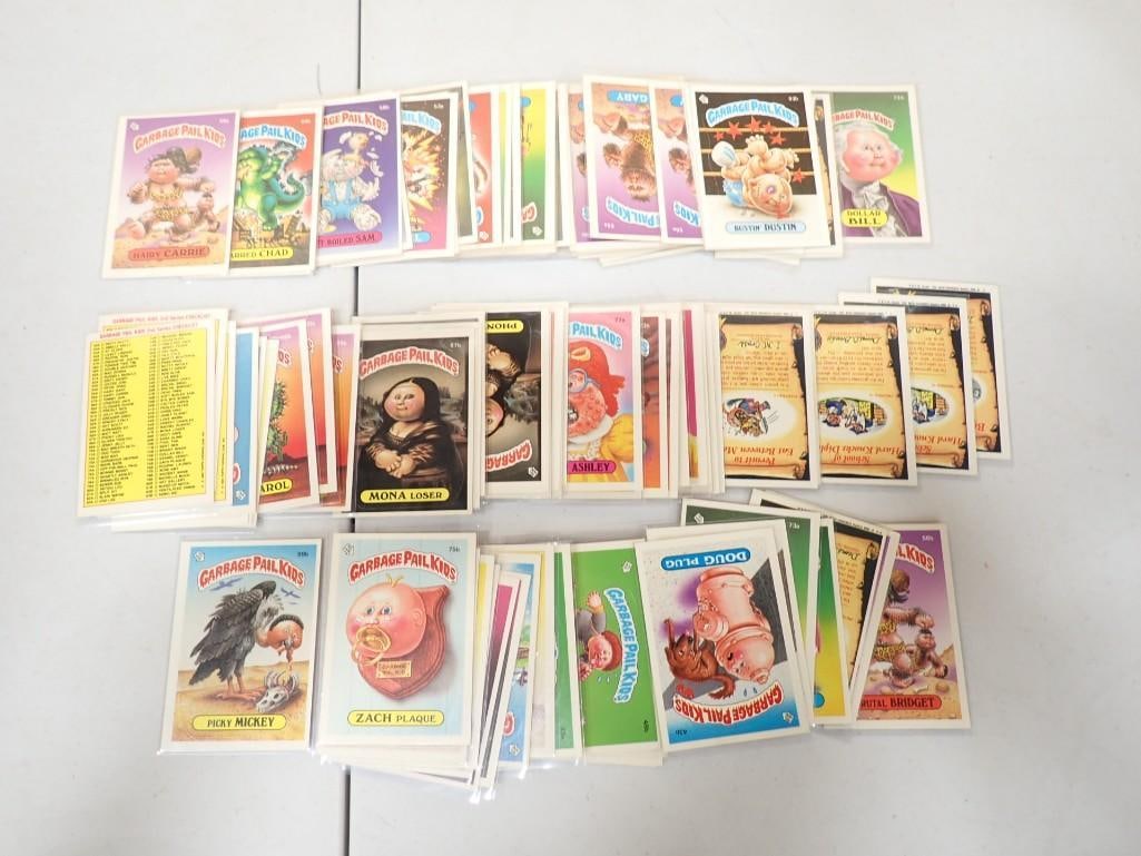 Lot of approximately 100 Topps Garbage Pail Kids Trading Cards mostly in sleeves: Lot of approximately 100 Topps Garbage Pail Kids Trading Cards mostly in sleeves. The lowest numbers are 42 and all of them are under 100
