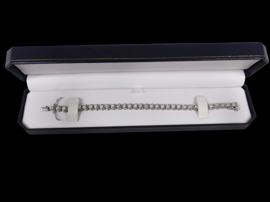 Sterling Silver and CZ Tennis Bracelet Heart Shaped 7": Sterling Silver and CZ Cubic Zirconia Tennis Bracelet Heart Shaped . Never worn. 7"