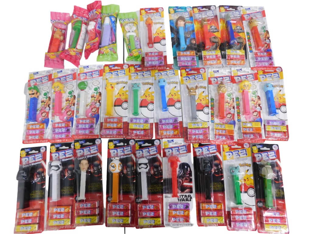 29 Pez Star Wars, Pokemon, Super Mario NIB Lot: Includes Star Wars, Pokemon, Super Mario, Donkey Kong, Jurrasic World, How to Train Your Dragon character and Holiday Pez with candy. All Pez are new, sealed, and in code. Great handouts for Halloween