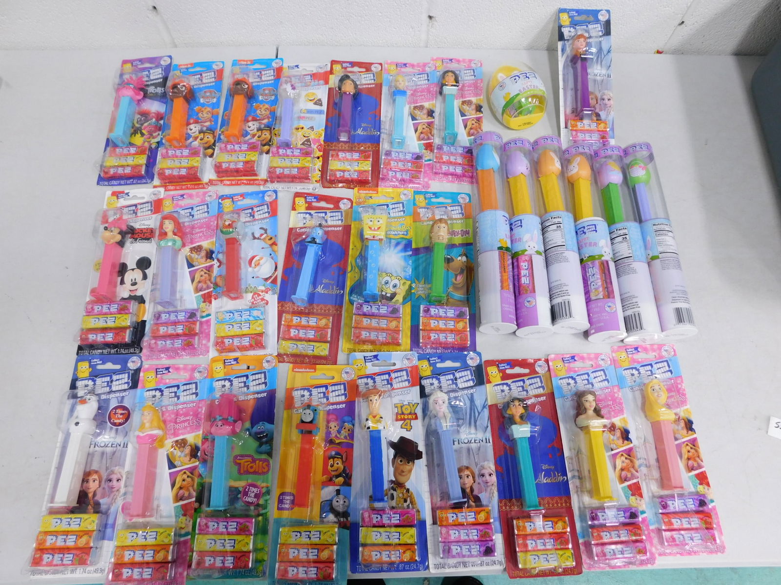 30 Huge Pez Lot All NIB & In Code: 30 Huge Pez Lot All NIB & In Code. Includes Disney Princess, Minnie Mouse, Toy Story, Trolls, Sponge Bob, Paw Patrol, Emoji, Christmas, Easter, etc. All Pez are new, sealed, and in code. Great handout