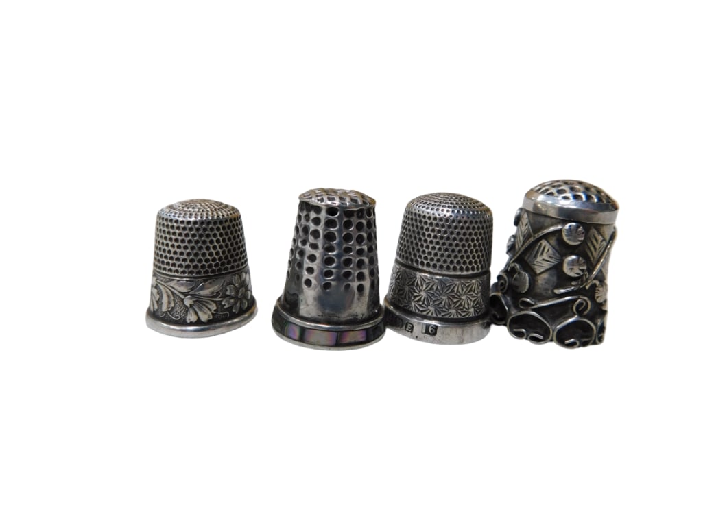 Four Sterling Silver Thimbles, One with Abalone Decoration: Four Sterling Silver Thimbles, One with Abalone Decoration Note: dime is for size comparison only and is not included